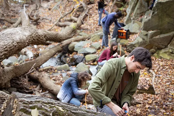 Scientists doing field work in a rocky terrain