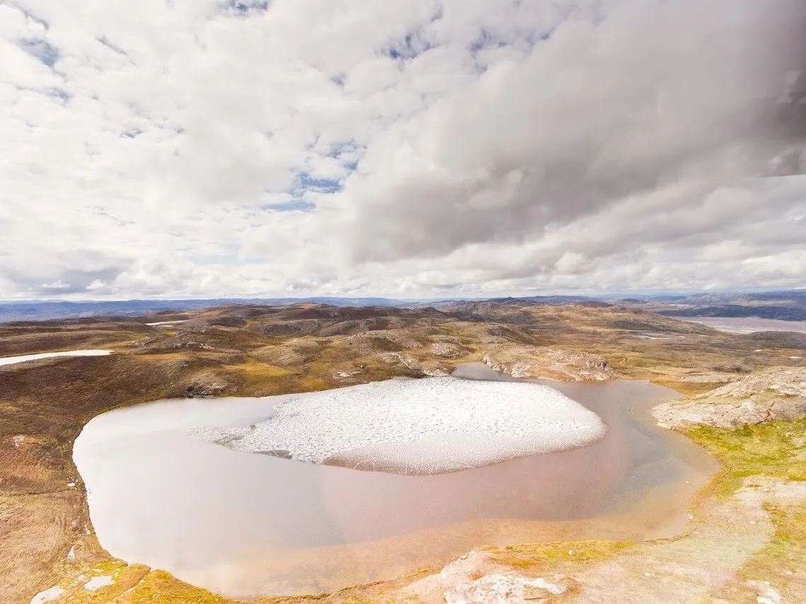 The Greenland ice is thought to have largely melted at least once in recent geologic time. Here, ice melts off a contemporary pond. Credit: Joshua Brown/University of Vermont