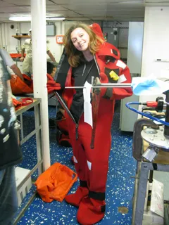 Nora Nikolov cinches her suit with a smile.
