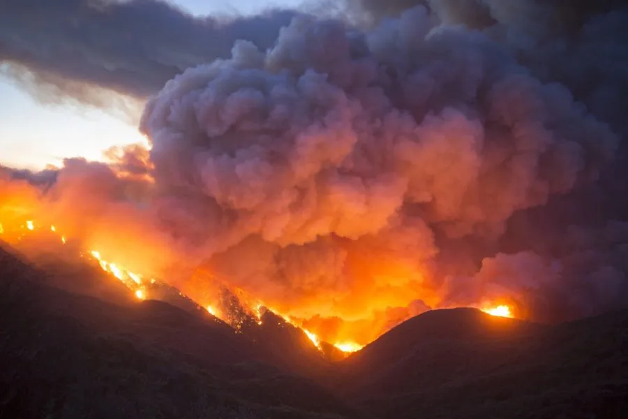 wildfires glowing on dark hills