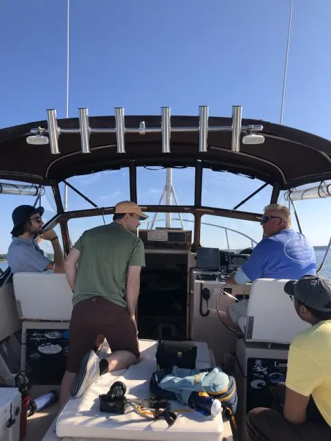 people chatting on the deck of a ship
