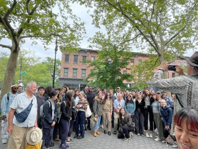 Large group gathered in an outdoor plaza
