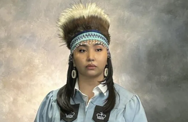 Graduation photo of Ropati in a traditional yupik headdress, made by the artist Golga Oscar. Credit: Charitie Ropati