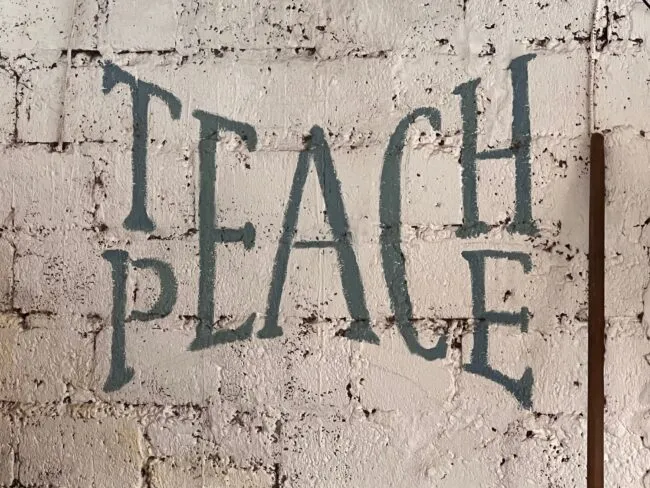 Wall in the city of Pokhara, Nepal that says Teach Peace (Joshua Fisher, AC4)
