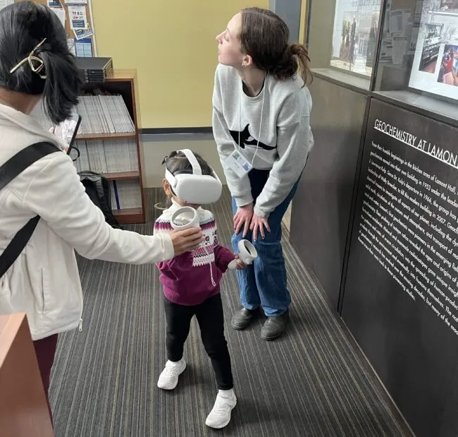 A young visitor tries out a VR headset