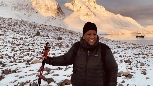 Woman poses on snowy terrain