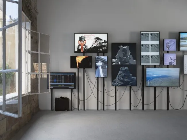 Screens with wires against a wall