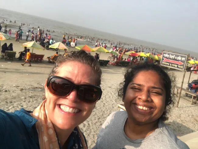 A selfie of two women on a beach