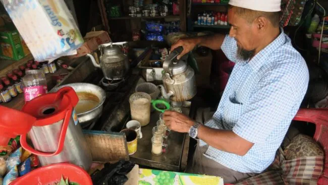 A man making milk tea