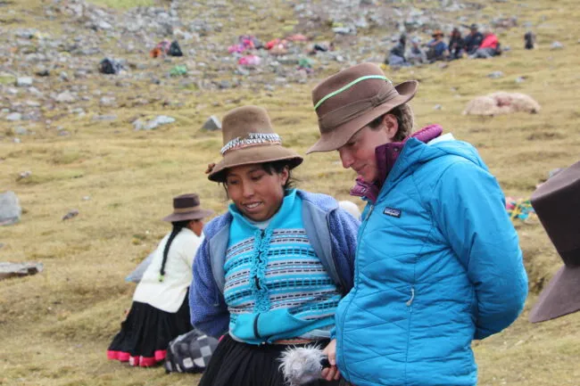 Two women discussing the day’s herding in the Peruvian Andes
