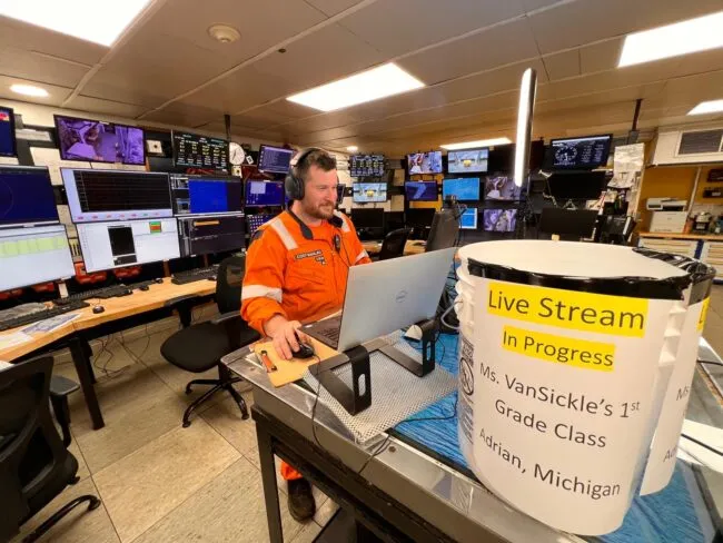 Operator in the Langseth control room livestreaming a first-grade class from Adrian, Michigan