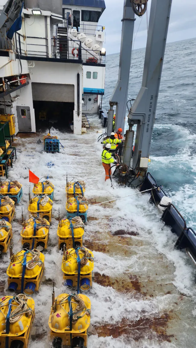 Deployment of seismometer instruments on ship in ocean