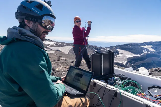 Conor Bacon and Einat Lev test the thermal camera before installing it in a aluminum casing. The computer and other electronics will be stored in rugged plastic cases, which will sit directly on the rim surface. Photo by Francesco Fiondella