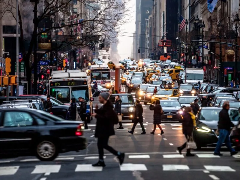 Pedestrians making their way through traffic in midtown nyc