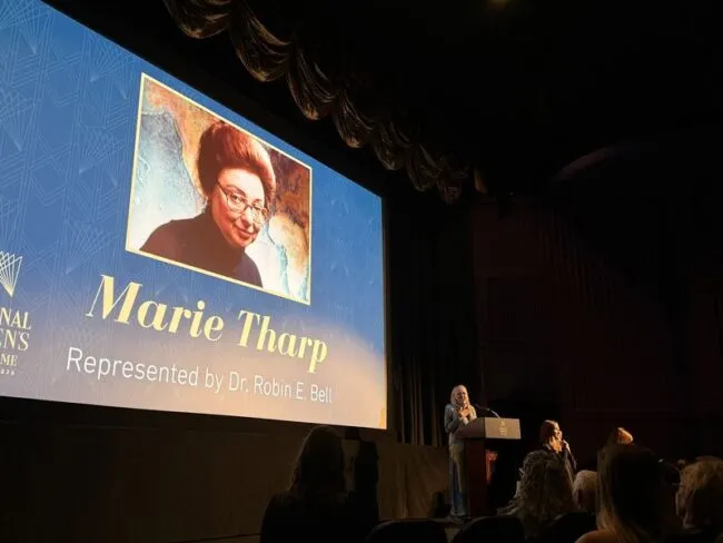 Presentation honoring Marie Tharp, represented by Dr. Robin E. Bell, with her portrait displayed on screen