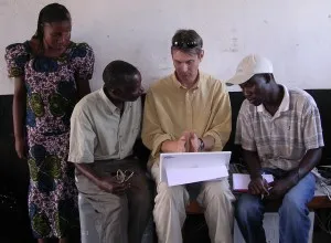Jim gives a lesson in data analysis to Loveness, Winstone, and Patrick.