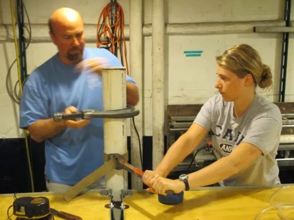 Cutting a sediment core into sections.