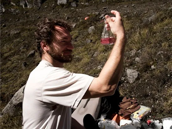 Ohio State University researcher Broxton Bird assists with the sampling