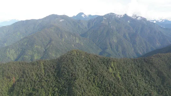 Lower-elevation mountains below the Puncak Jaya summit, taken from helicopter, between the towns of Timika and Tembagapura. 