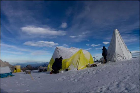 The ice drill is in the tall tent to right; you can see the pipes we use, just outside.