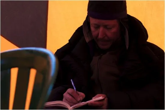 Team member Vladimir Mikhalenko of the Russian Academy of Sciences, a veteran of many such expeditions, logs his notes for the day.