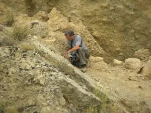 The flat slope behind the city of Cassano is another normal, limestone fault. Credit: Meg Reitz.