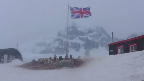The weather turned during our stop at the historic British Station of Port Lockroy (Photo M. Turrin).The weather turned during our stop at the historic British Station of Port Lockroy (Photo M. Turrin).