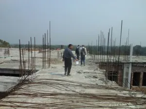 We examined the roof for the GPS.  It would be a good site, but the columns were unfinished rebar rods.  We would have to wait until they were finished.