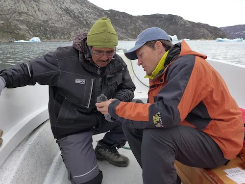 Magnus Petersen and Dave Porter review GPS locations for CTD casts. (Photo M. Turrin)