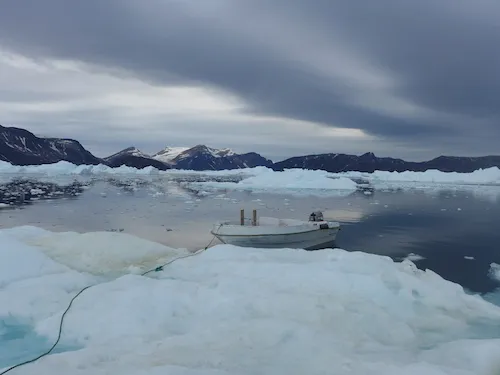 Tying up on the iceberg to check for access in the mélange. (Photo M. Turrin)