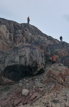 A look out is taken by our guides from on top of Alison Fjord's northern flank. (Photo M. Turrin) 