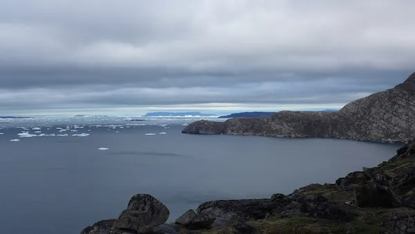 Alison Glacier flows into Melville Bay just behind the rocky foot of Kullorsuaq (visible at the top of this photo). The bits of ice debris are loosely jumbled at this distance from the glacier front unlike at the mouth where they are densely packed. (Photo M. Turrin)
