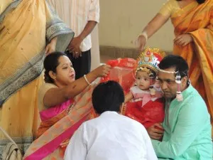 A baby receives her first solid food in a ceremony at the Daleshwari Temple in Old Dhaka