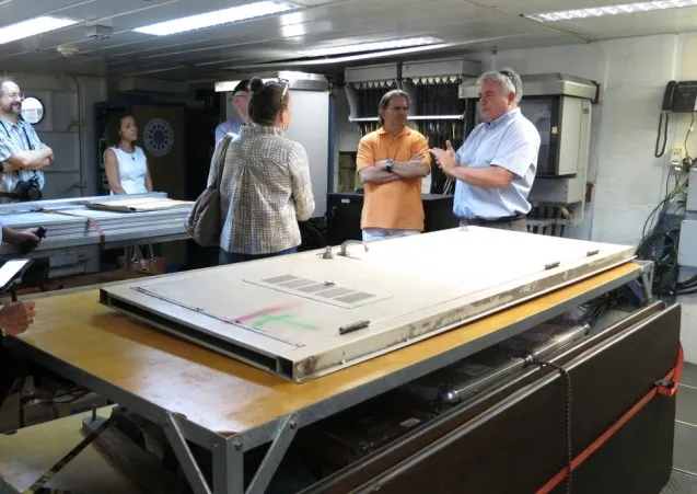 Sean Higgins shows visitors the Langseth labs where scientists work at sea.