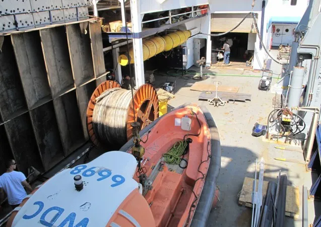 Crew members prepare the Langseth for its next expedition.