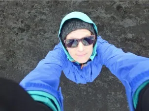 Elise Rumpf prepares to catch Buzz as it descends. The ground was too rough to land the UAV. 