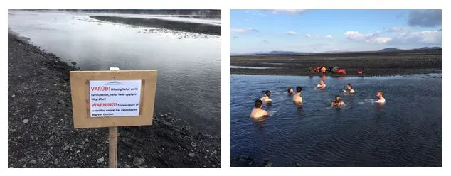 The group bathes in a section of the river with pleasant temperatures, while a sign warns of the hot water at the next stream over. 
