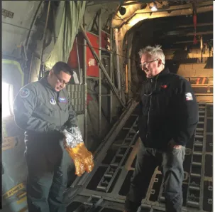 Air National Guard, complete with IcePod patch on his uniform, reviewing safety breathing apparatus with Sylvain Pascaud, filmmaker  LCL production interested in technology and airborne science. 