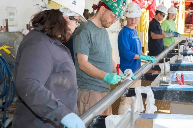 The team aboard the JOIDES Resolution collected the first four cores of Expedition 361 from the Natal Valley site. Here, scientists prepare to open the first. (Tim Fulton/IODP)