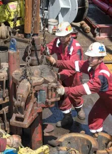 The drilling crew works with equipment aboard the JOIDES Resolution. Photo: Tim Fulton/IODP