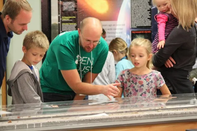 The Lamont Core Lab was another favorite, with visitors lined up out the door. Billy D'Andrea shows young guests how scientists use deep-sea sediment cores to learn about climates in the past.