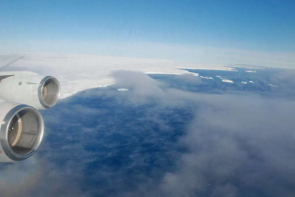 Flying over the floating part of Pine Island Glacier. Winds have blown away the sea ice to create an area of open water called a polynya.