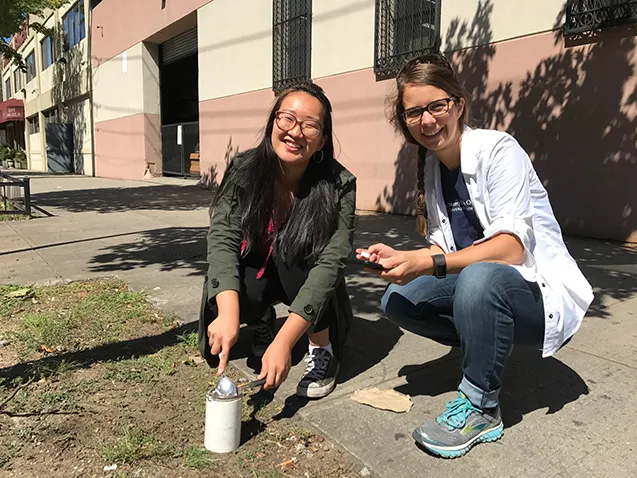 taking soil samples on sidewalk in greenpoint