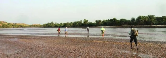 Research team crossing the Turkwel River
