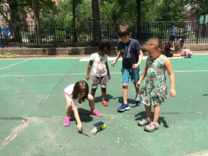 students play with solar powered bicycle