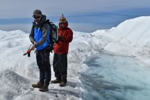 marco tedesco taking albedo measurements in greenland