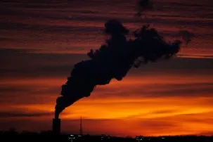 black smoke from a smokestack