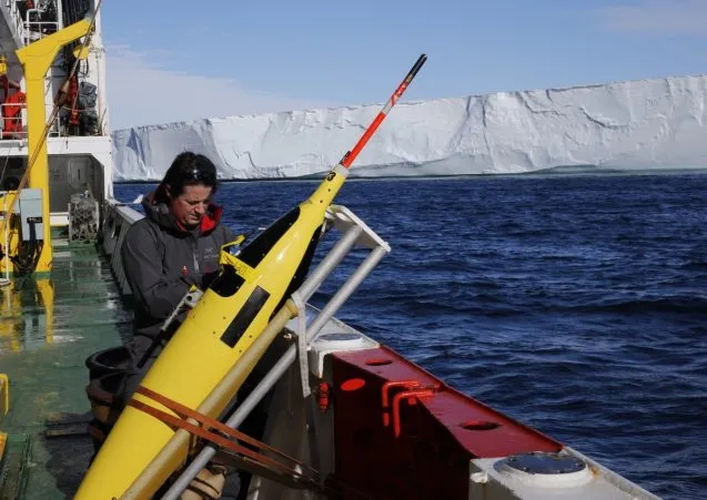 Pierre Dutrieux preparing a Seaglider for deployment in front of the Dotson Ice Shelf, West Antarctica, during a summer 2018 research expedition. (Photo courtesy of Pierre Dutrieux)