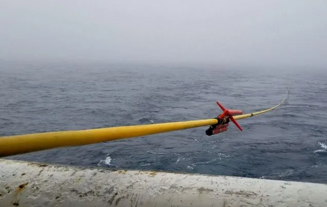 cable extending behind the ship