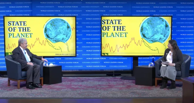 raymo and guterres on stage